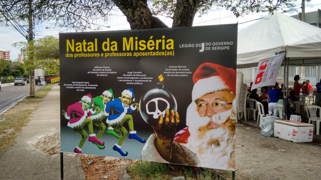 O cartaz do Sintese criticando a Legião do Jota